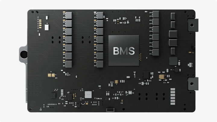Close-up view of a BMS circuit board showing intricate electronic components and connections.