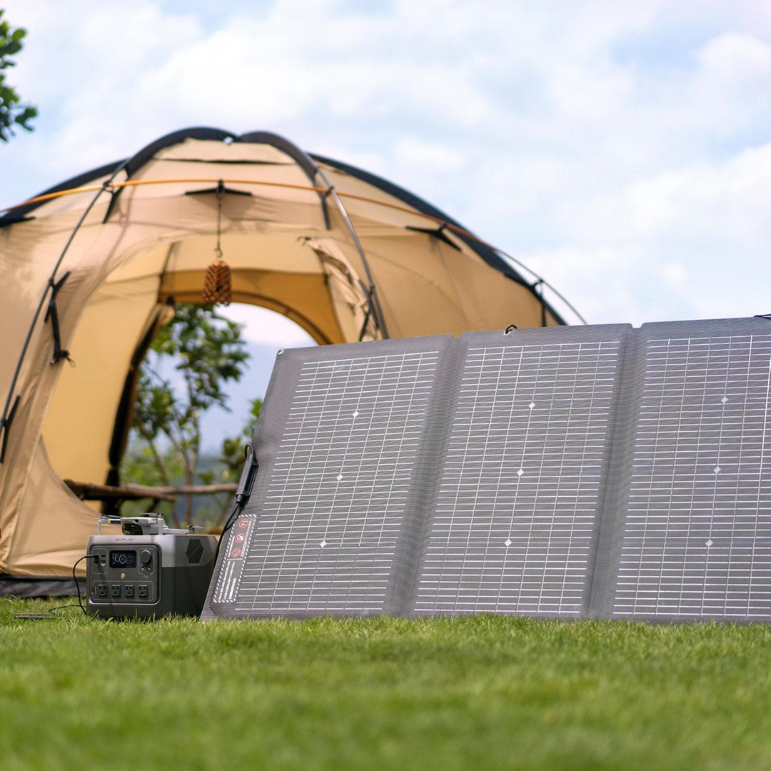 EcoFlow RIVER 2 Pro Power Station 768Wh With A 220W Portable Solar Panel next to a camping tent.