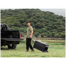 Load image into Gallery viewer, EcoFlow Glacier Portable Refrigerator Electric Cooler with 120W Compressor being used outdoors, curbside next to a truck.
