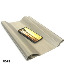 Load image into Gallery viewer, Faraday Cyber NC-RS EMF RF shielding nickel copper rip-stop fabric roll with phone on top, demonstrating conductive properties.
