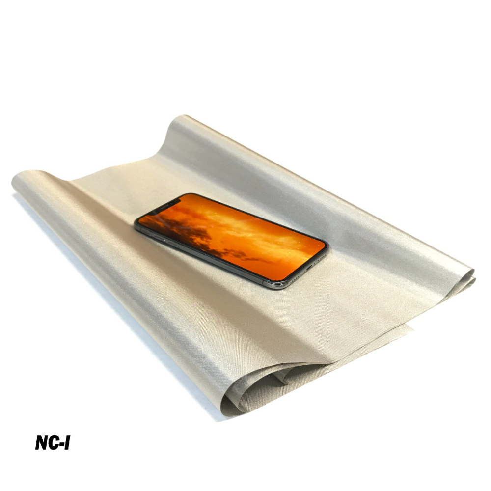 Faraday Cyber NC Fabric EMF RF Shielding Nickel Copper Fabric Roll with phone on top.