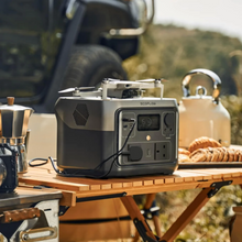 Load image into Gallery viewer, EcoFlow RIVER 2 Max Portable Power Station on outdoor table, lightweight, safe, reliable, camping setup.
