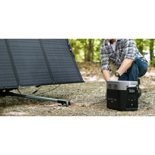 Load image into Gallery viewer, EcoFlow DELTA Max 2000 power station with portable solar panel in use outdoors.
