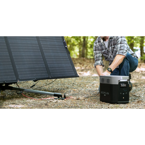 EcoFlow DELTA Max 2000 power station with portable solar panel in use outdoors.