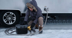 Man using EcoFlow DELTA 1300 Portable Power Station in snow.